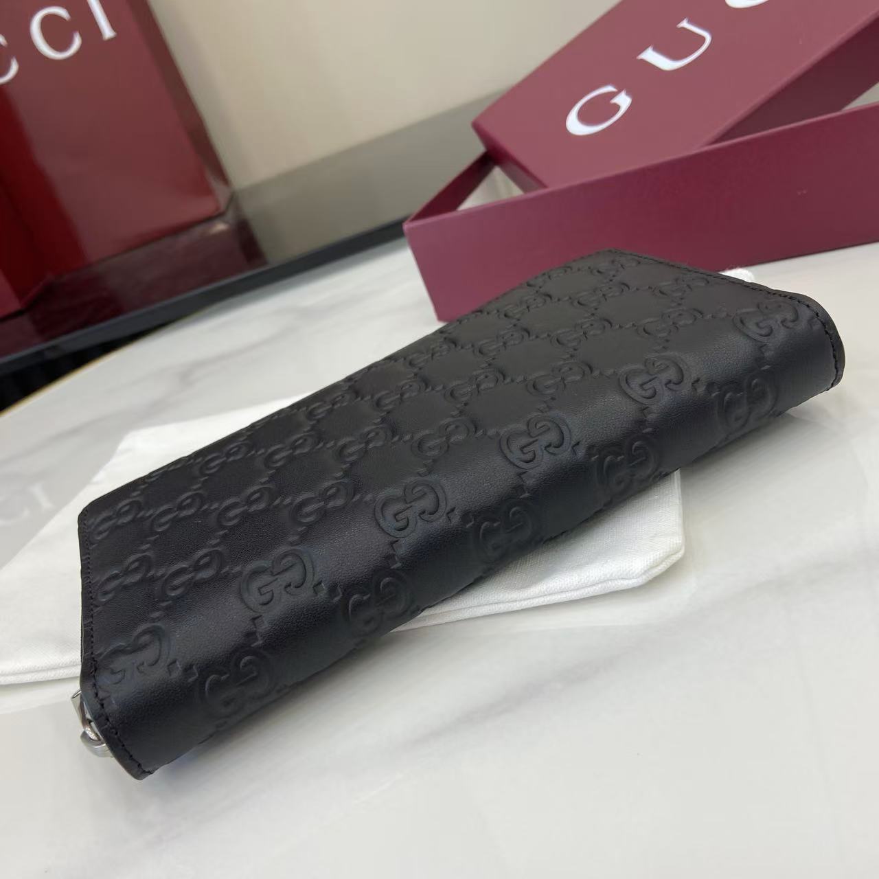 Gucci GG Emblem Zip Around Wallet - FashionPlug