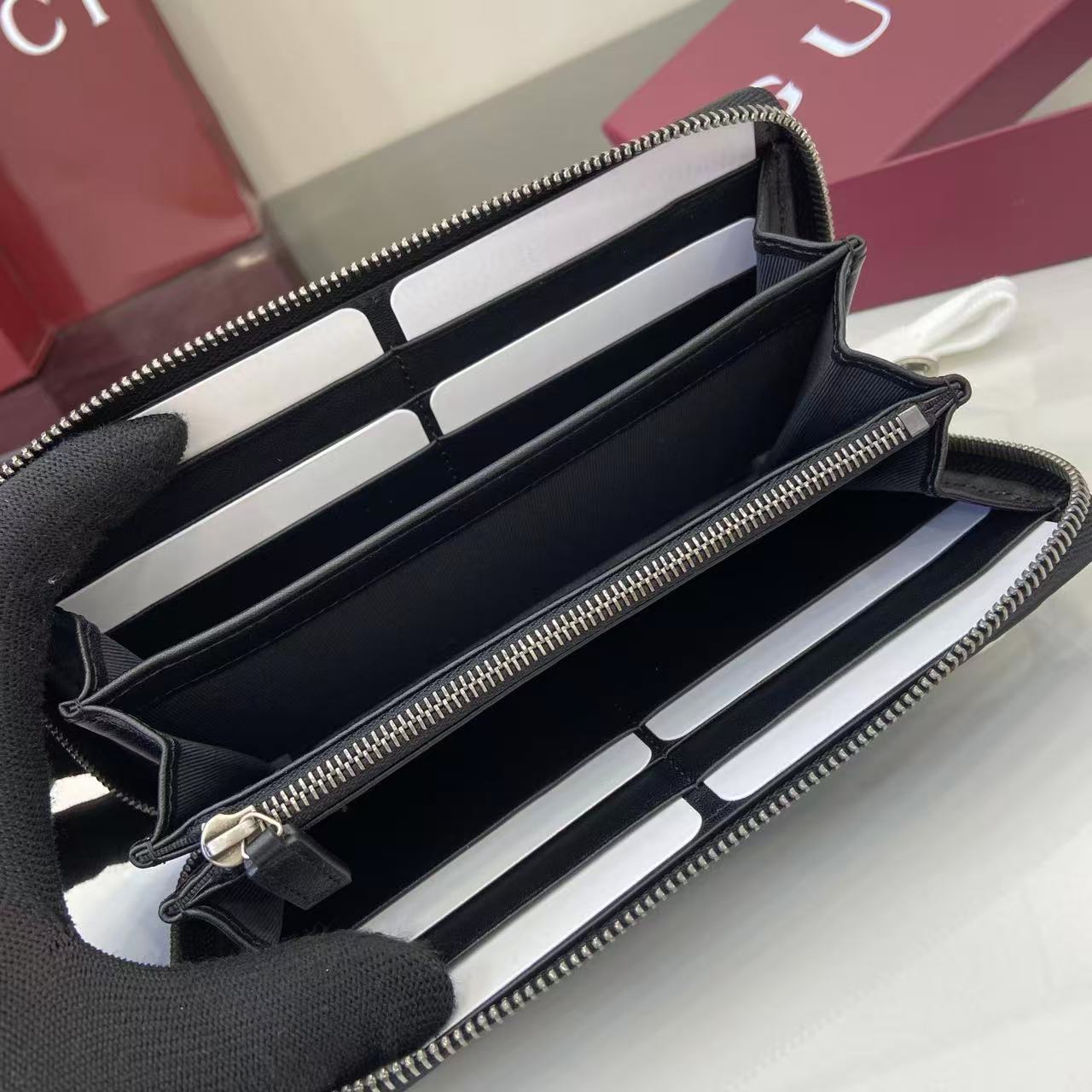 Gucci GG Emblem Zip Around Wallet - FashionPlug