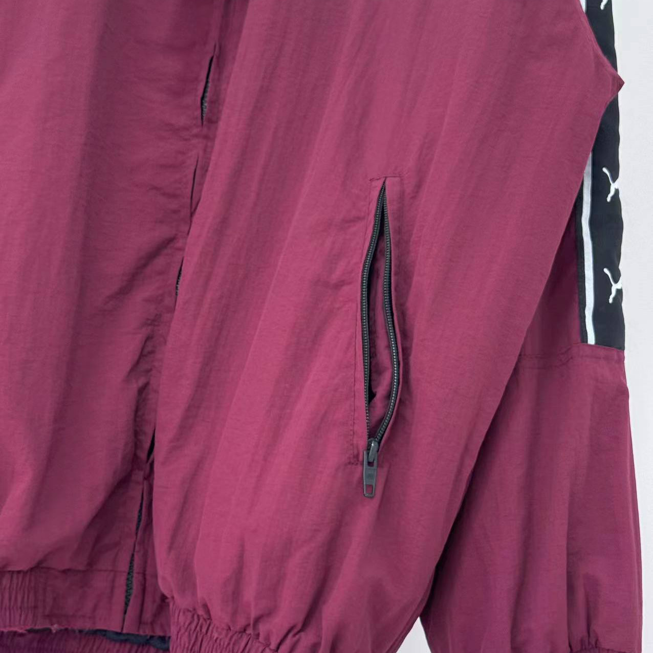 Balenciaga I PUMA Tracksuit Jacket in burgundy - FashionPlug