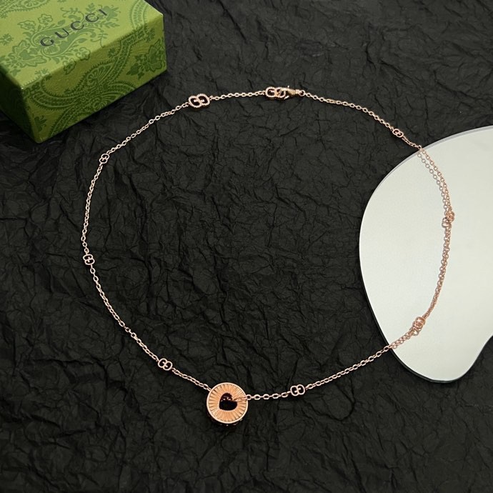 Gucci Icon Round Heart Cut Out Pendant - FashionPlug