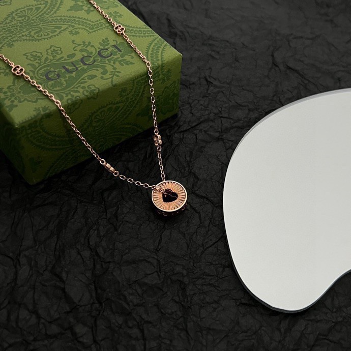 Gucci Icon Round Heart Cut Out Pendant - FashionPlug