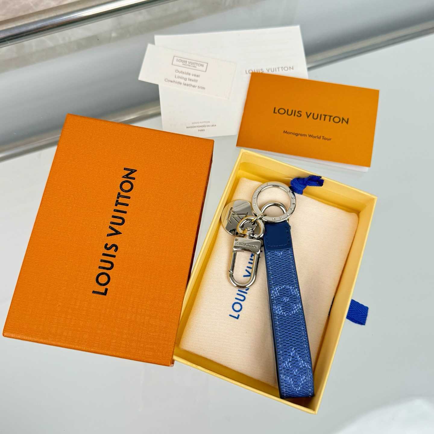 Louis Vuitton LV Slim Dragonne Key Holder and Bag Charm S00  - FashionPlug