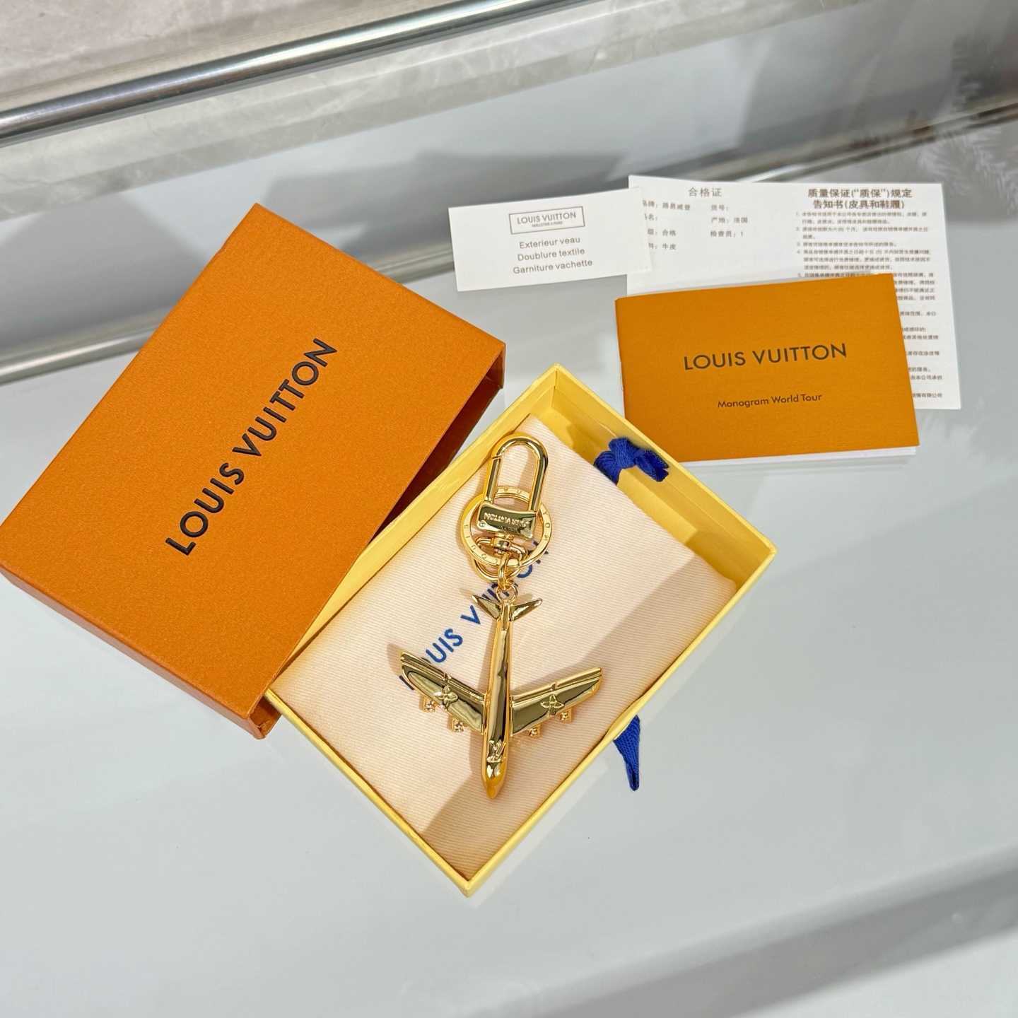 Louis Vuitton LV Plane Key Holder and Bag Charm S00 - FashionPlug