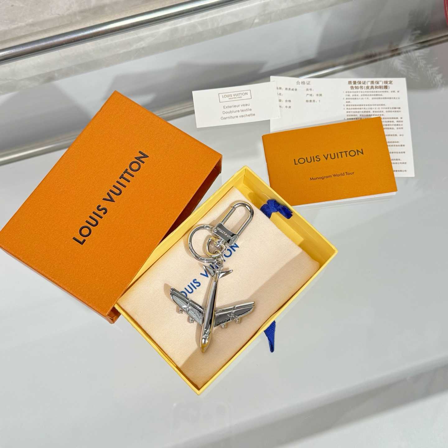 Louis Vuitton LV Plane Key Holder and Bag Charm S00 - FashionPlug