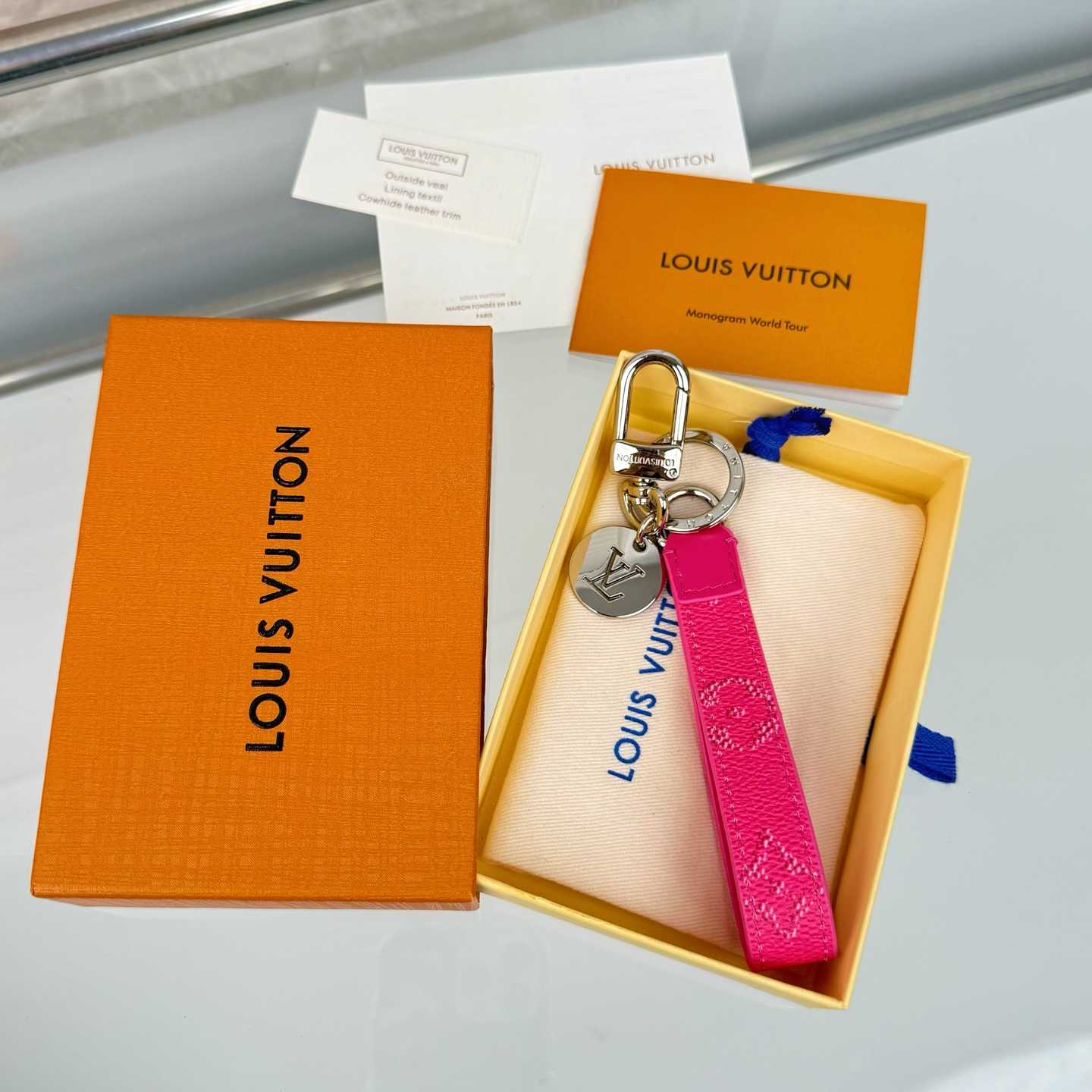 Louis Vuitton LV Slim Dragonne Key Holder and Bag Charm S00  - FashionPlug