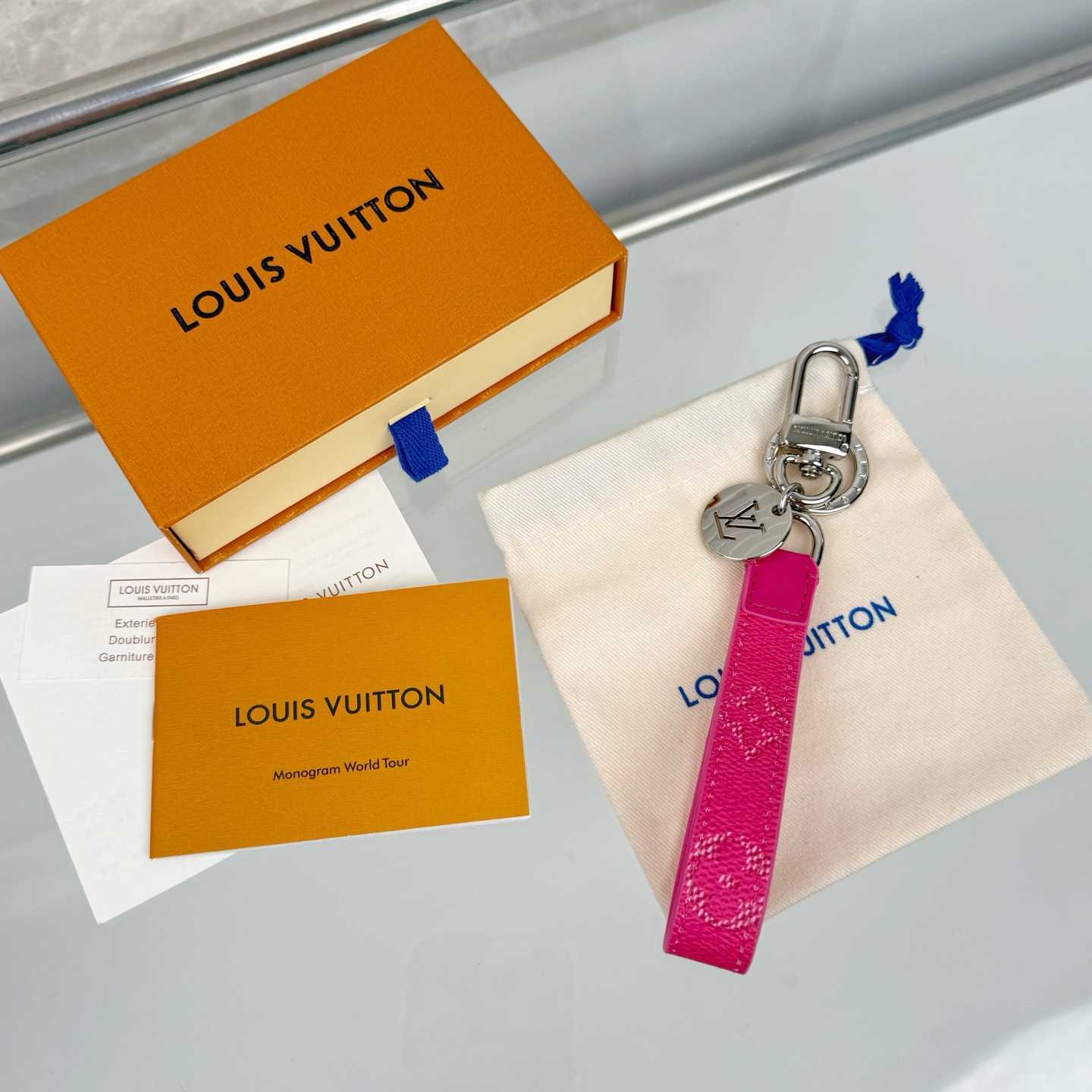 Louis Vuitton LV Slim Dragonne Key Holder and Bag Charm S00  - FashionPlug