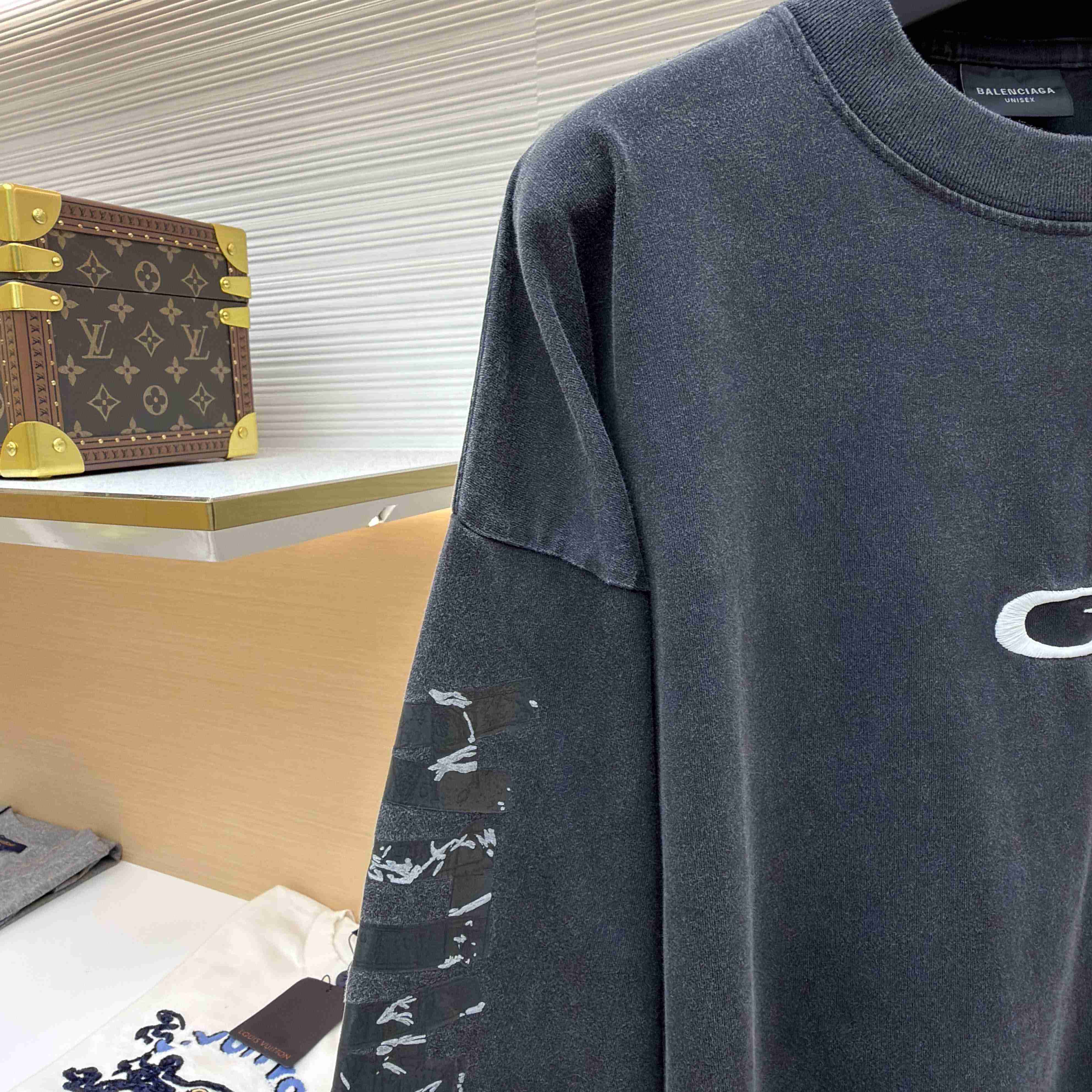 Balenciaga Men's Transparent Tape Shifted Oversized Long Sleeve T-shirt - FashionPlug