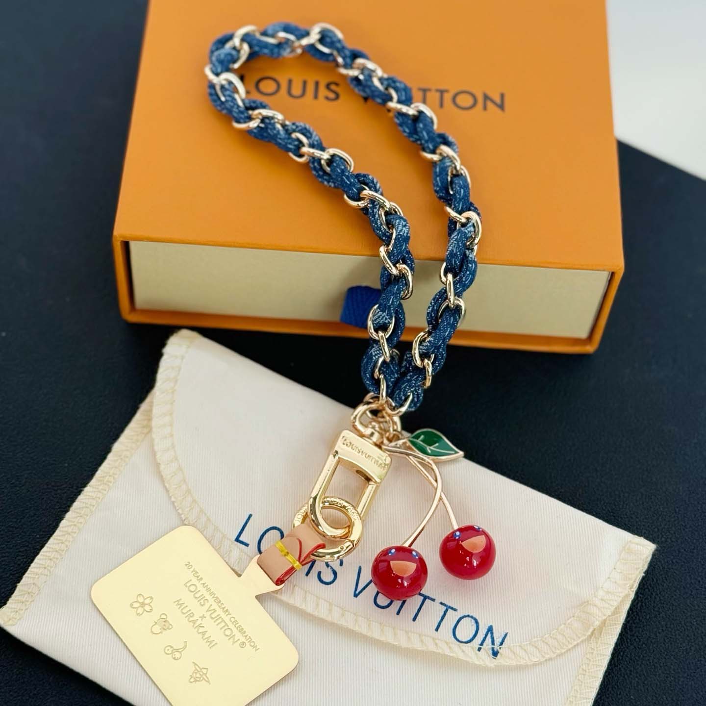 Louis Vuitton LV x TM Denim Cerise Phone Holder S00   M02623 - FashionPlug