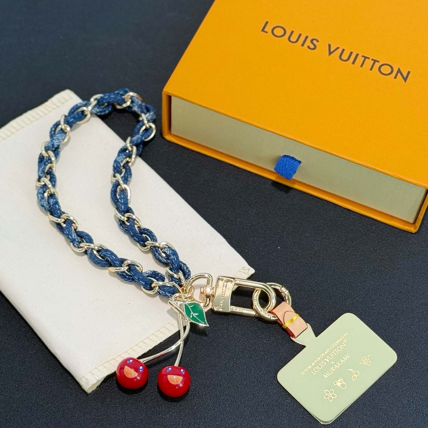 Louis Vuitton LV x TM Denim Cerise Phone Holder S00   M02623 - FashionPlug