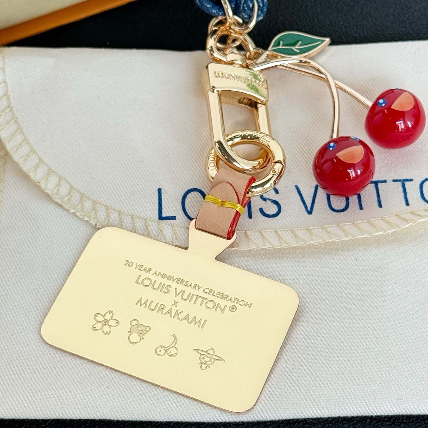 Louis Vuitton LV x TM Denim Cerise Phone Holder S00   M02623 - FashionPlug