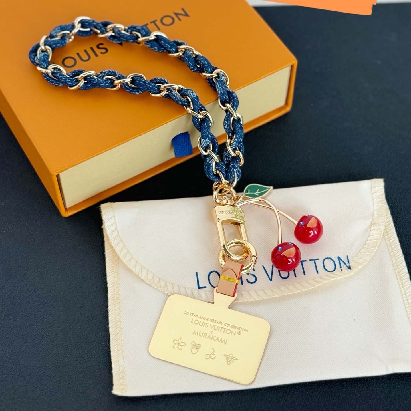 Louis Vuitton LV x TM Denim Cerise Phone Holder S00   M02623 - FashionPlug