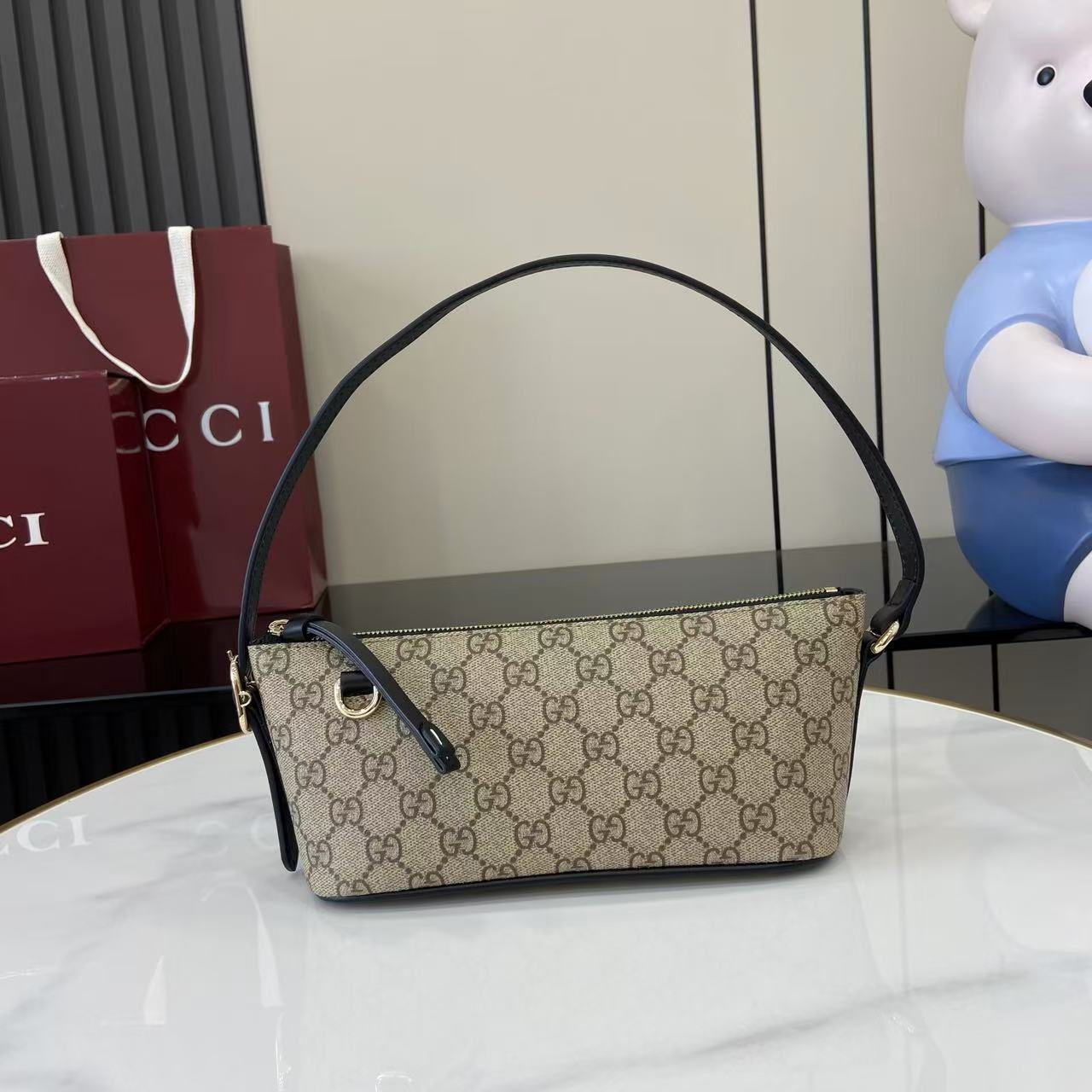 Gucci GG Emblem Small Shoulder Bag - FashionPlug