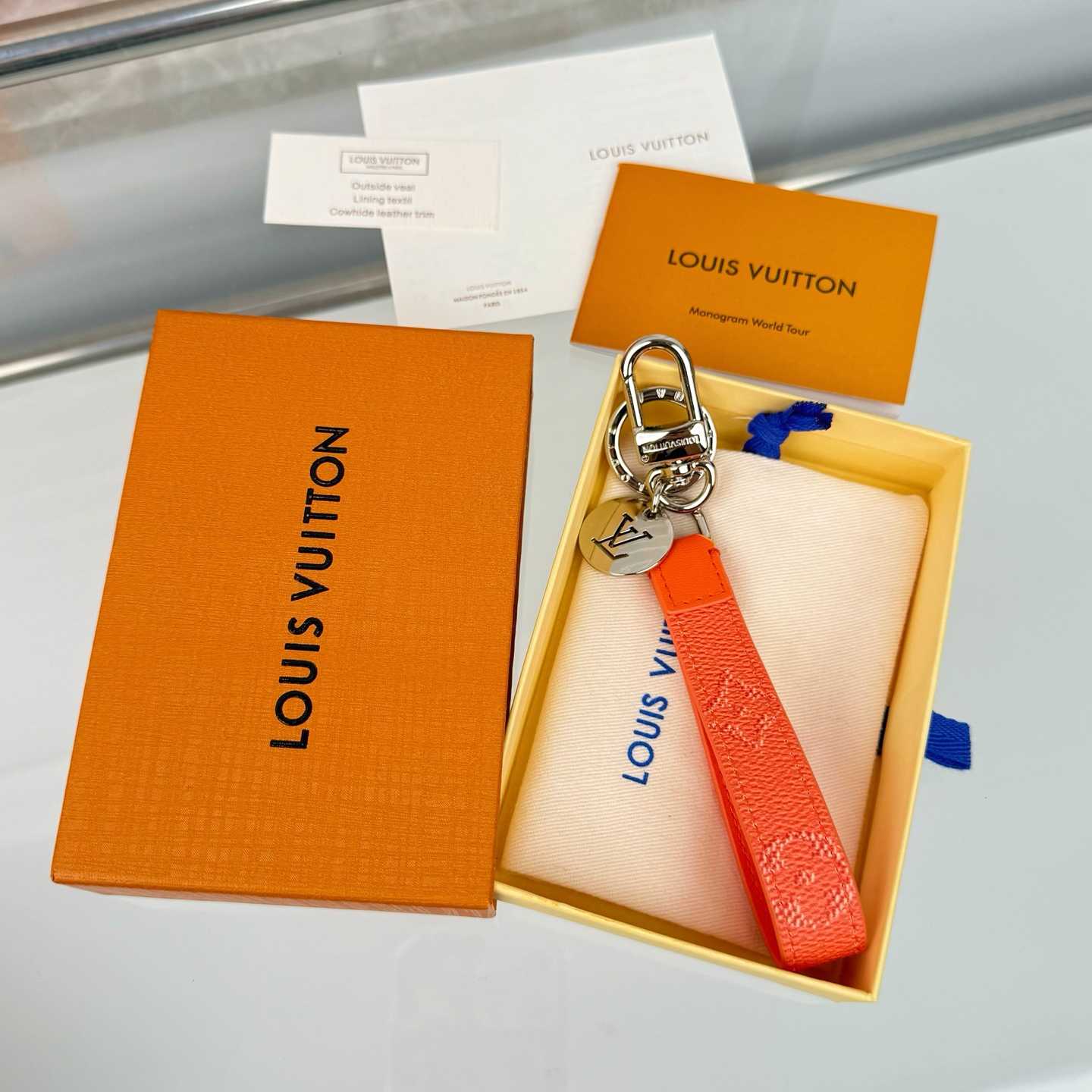 Louis Vuitton LV Slim Dragonne Key Holder and Bag Charm S00  - FashionPlug