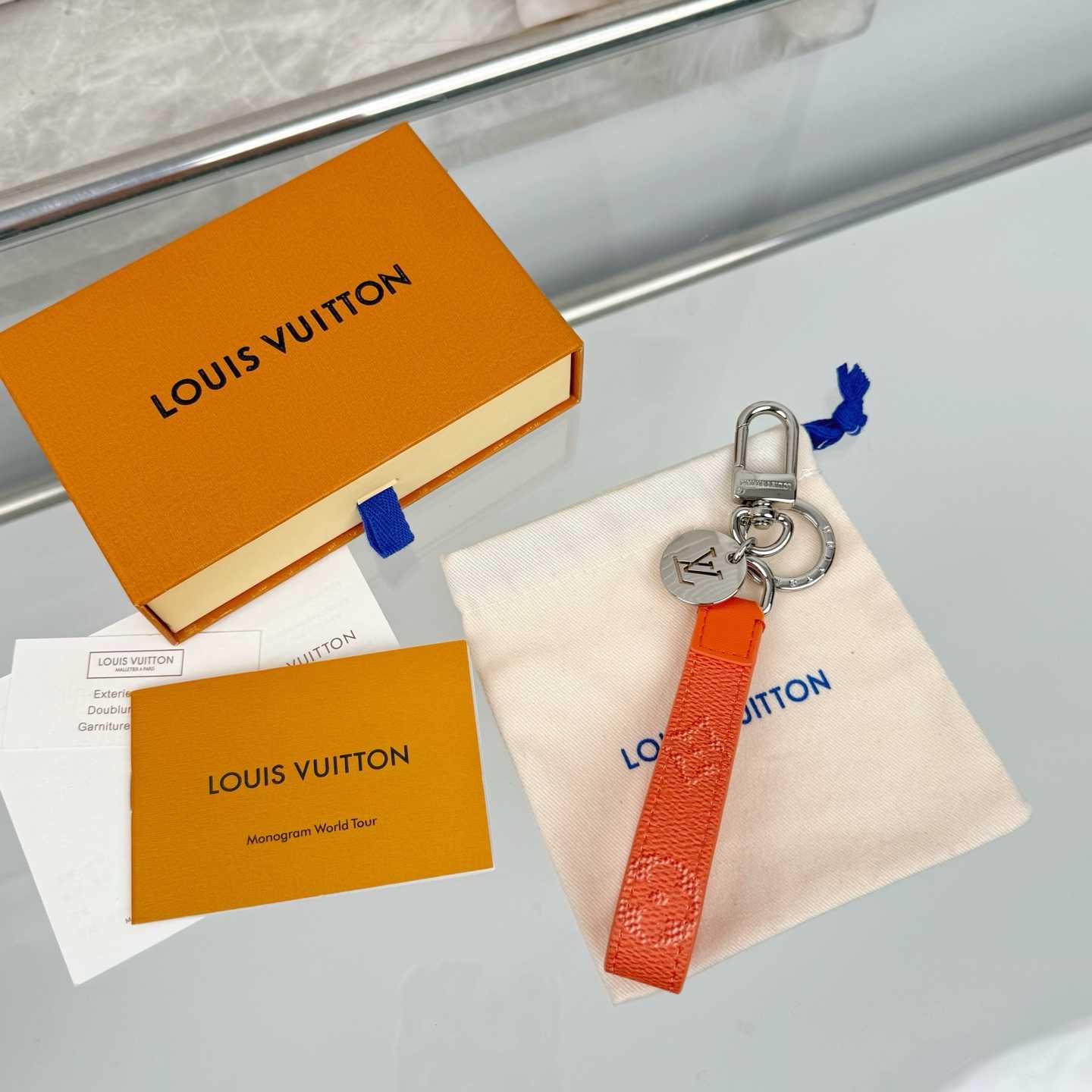 Louis Vuitton LV Slim Dragonne Key Holder and Bag Charm S00  - FashionPlug