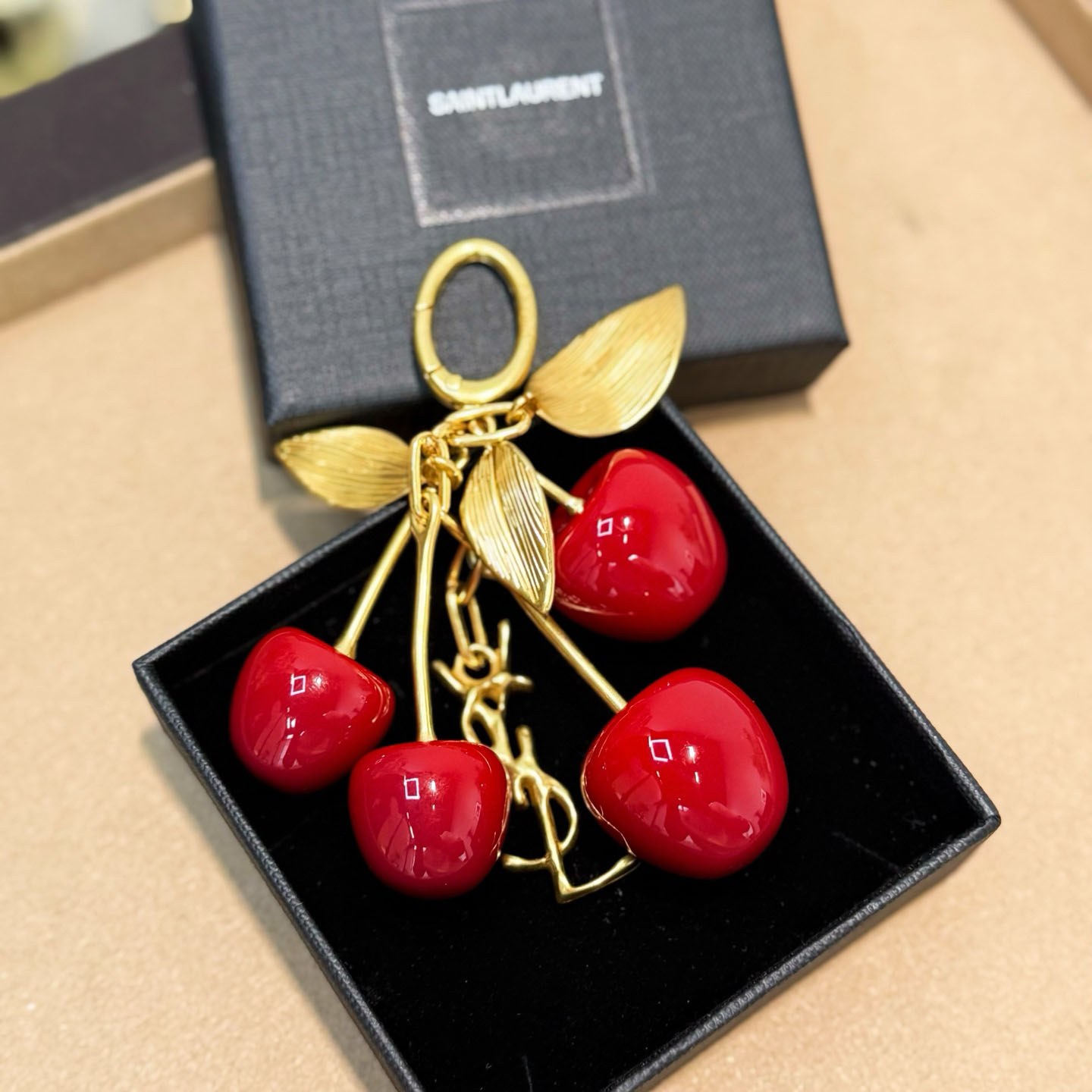 Saint Laurent CASSANDRE Cherry Bag Charm In Resin And Metal - FashionPlug