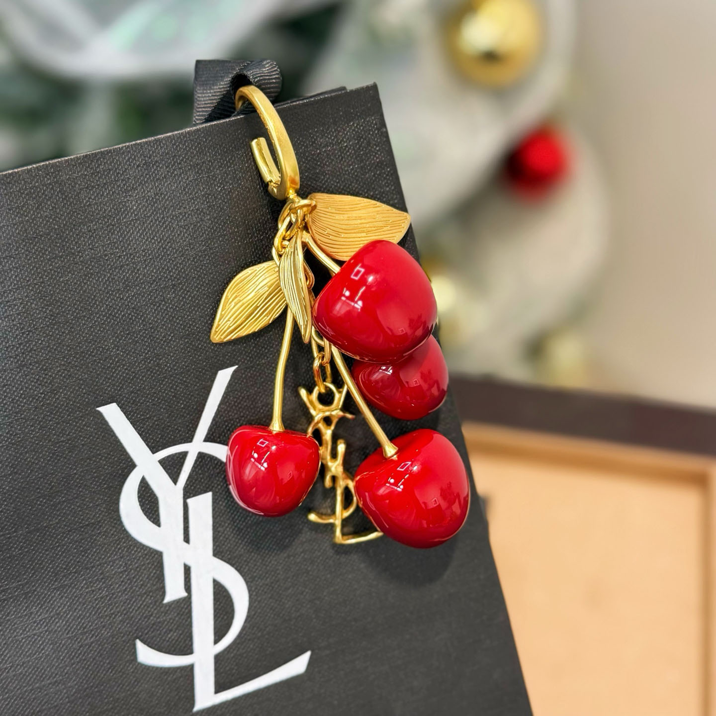 Saint Laurent CASSANDRE Cherry Bag Charm In Resin And Metal - FashionPlug