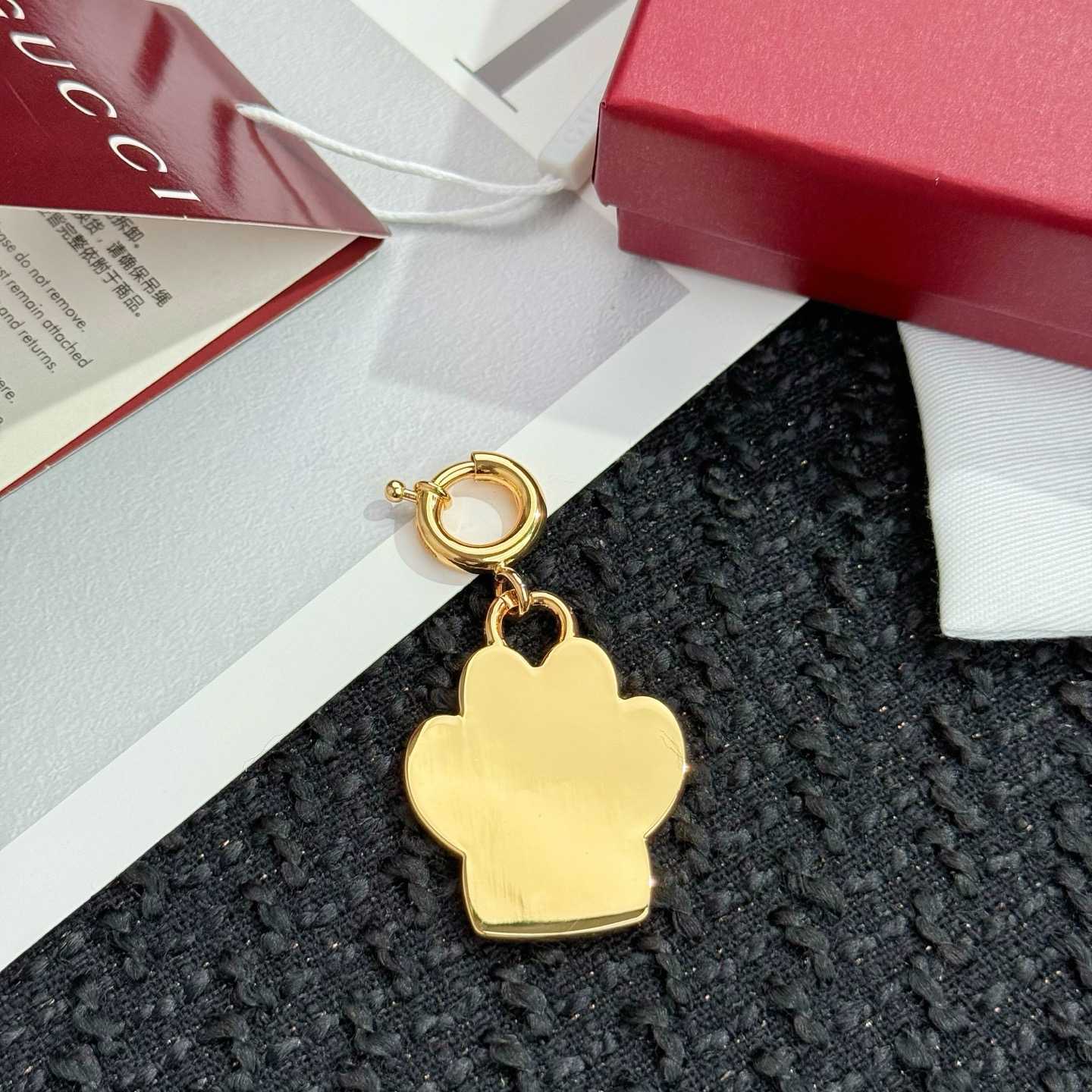 Gucci Paw-shaped Charm - FashionPlug