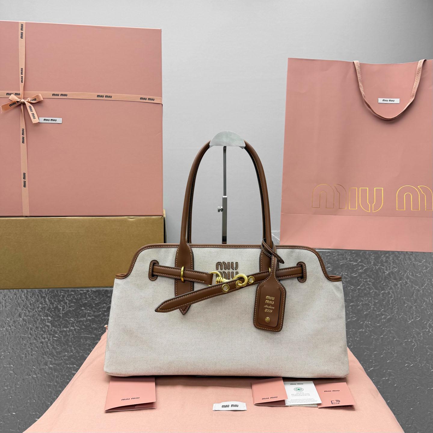 Miu Miu Aventure Canvas And Leather Bag - FashionPlug