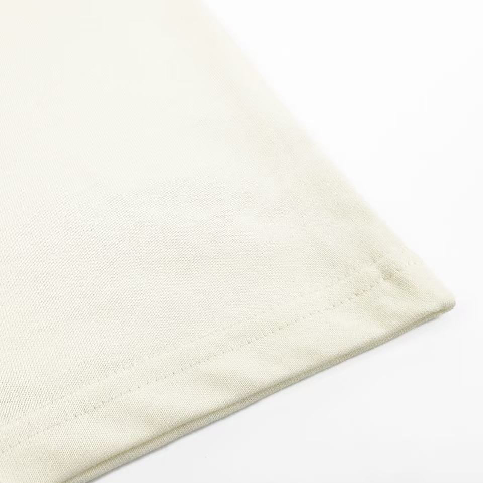 AMI Paris White And Green Cotton Ami De Coeur Knitted Patch T-shirt - FashionPlug