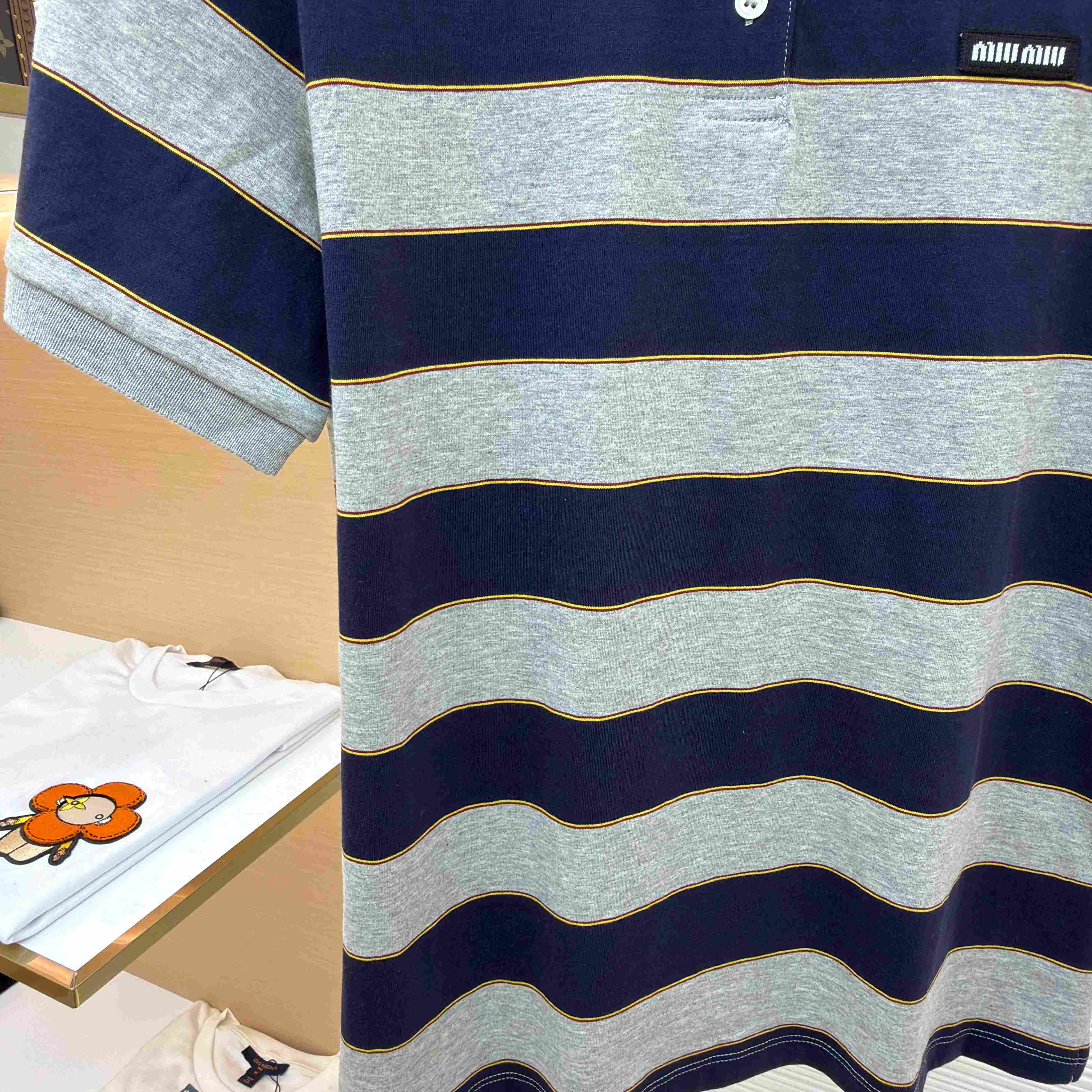 Miu Miu Striped Jersey Polo Shirt - FashionPlug