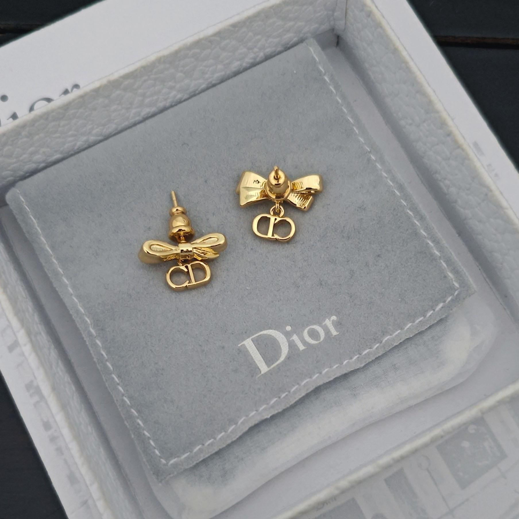 Dior CD Bow Earrings - FashionPlug