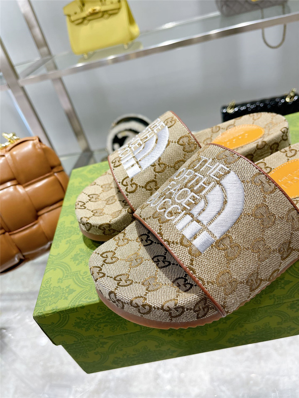 Gucci X The North Face GG Logo Slides - FashionPlug