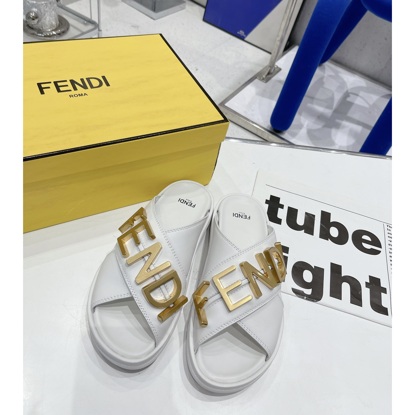 Fendi Graphy White Leather Slides - FashionPlug