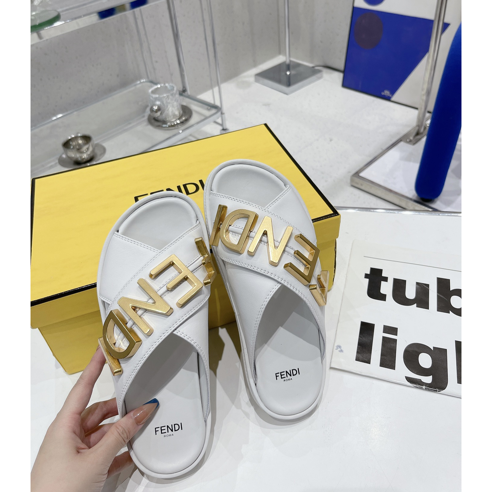Fendi Graphy White Leather Slides - FashionPlug