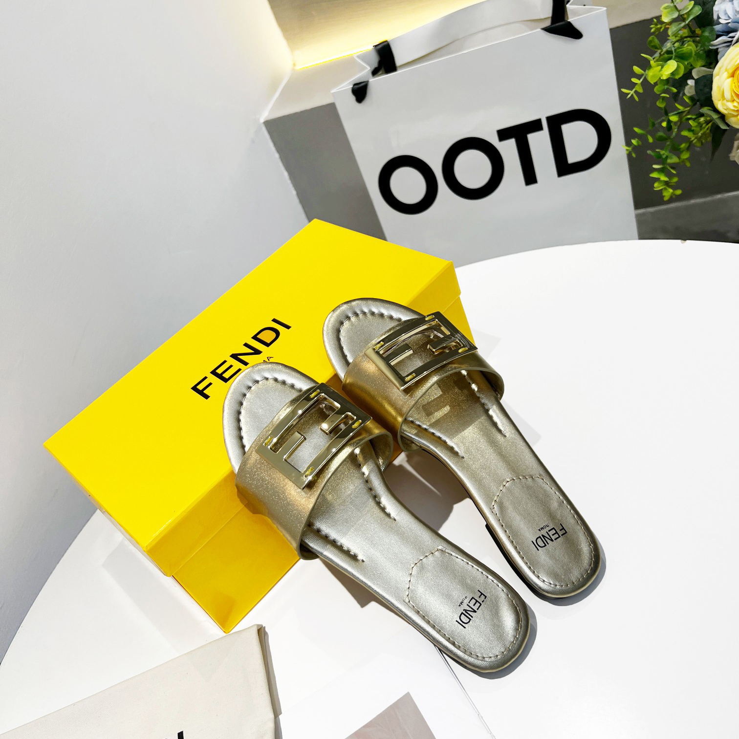 Fendi Baguette Gold nappa leather slides - FashionPlug