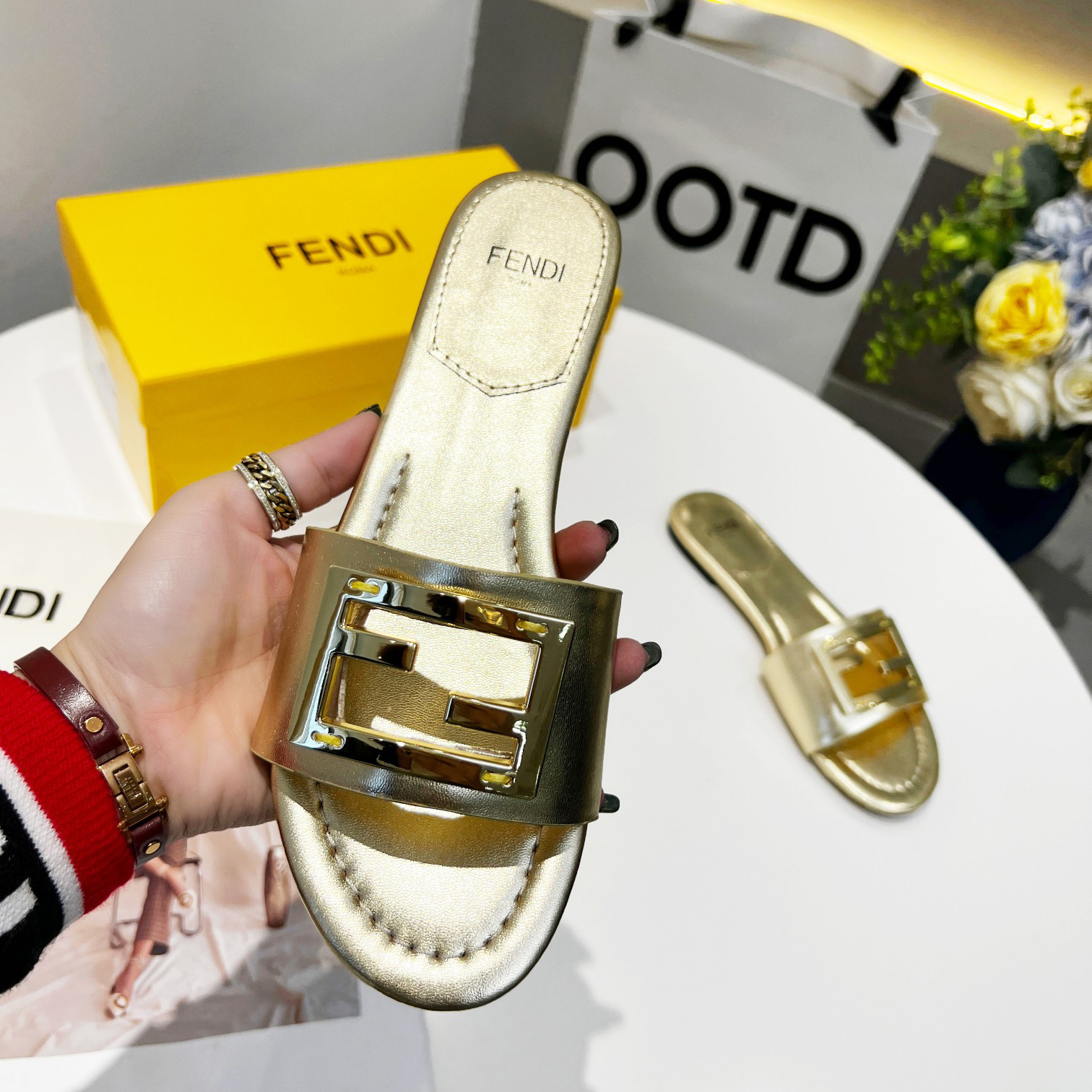 Fendi Baguette Gold nappa leather slides - FashionPlug