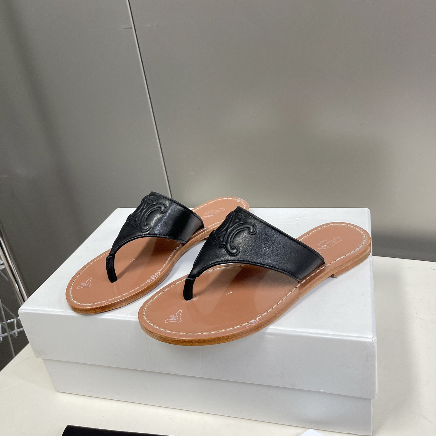 Celine Triomphe Flat Thong In Calfskin Black - FashionPlug