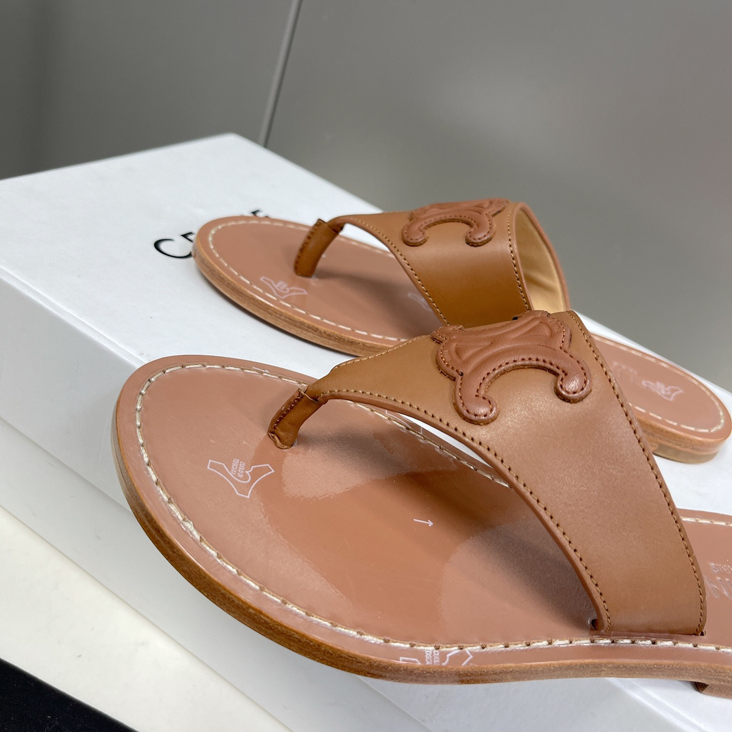 Celine Triomphe Flat Thong In Calfskin Tan - FashionPlug