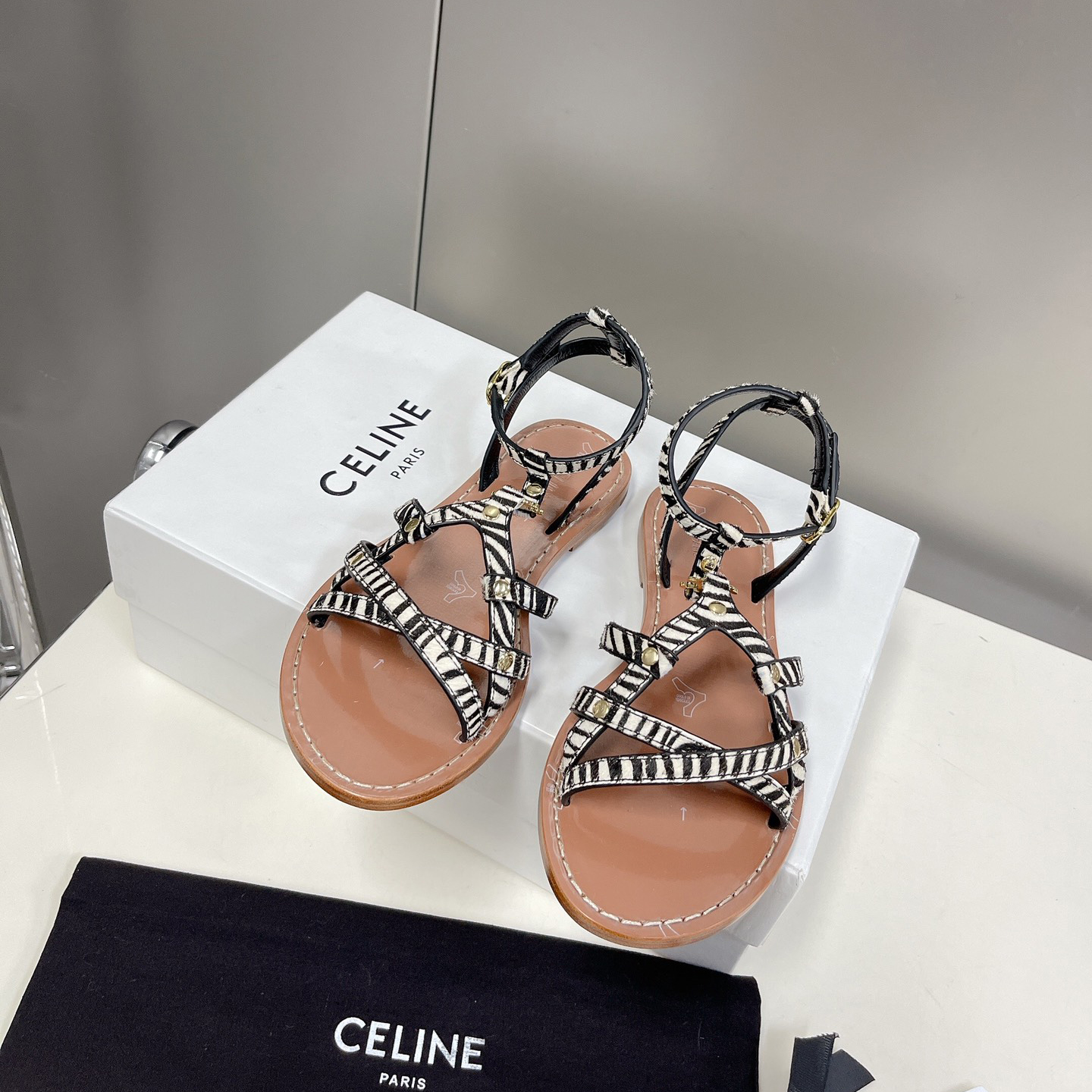 Celine Taillat Triomphe Sandal In Zebra Printed Hairy Calfskin Black/White - FashionPlug