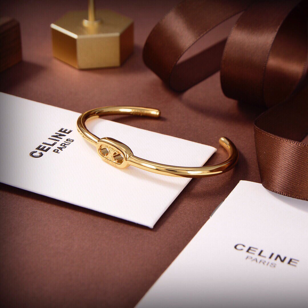 Celine Maillon Triomphe Thin Cuff In Brass With Gold Finish - FashionPlug