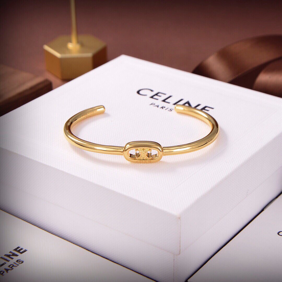 Celine Maillon Triomphe Thin Cuff In Brass With Gold Finish - FashionPlug