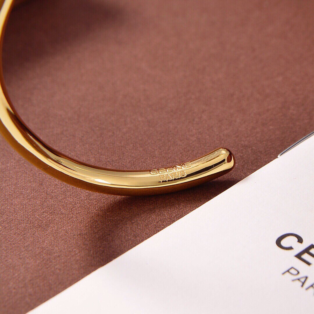 Celine Maillon Triomphe Thin Cuff In Brass With Gold Finish - FashionPlug