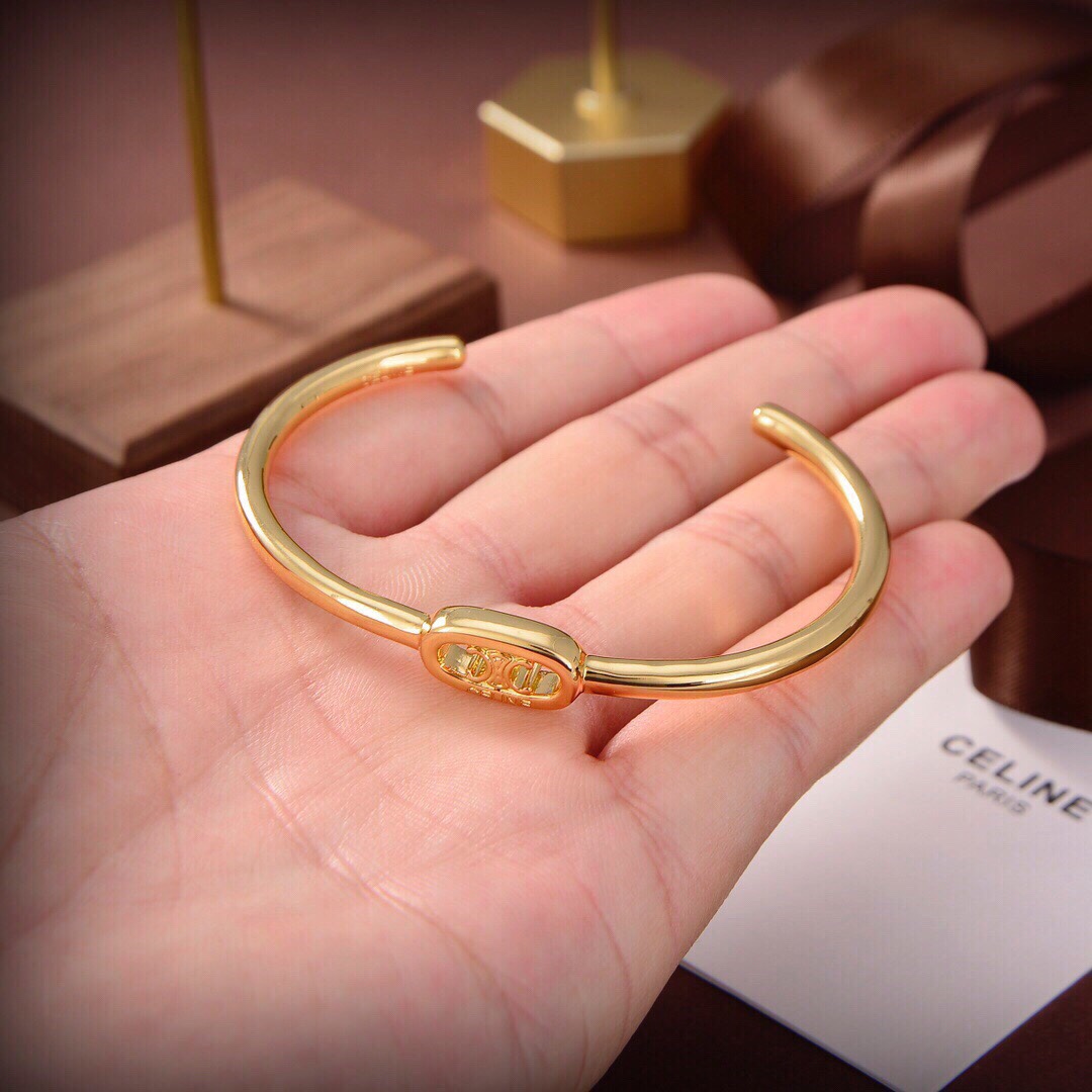 Celine Maillon Triomphe Thin Cuff In Brass With Gold Finish - FashionPlug