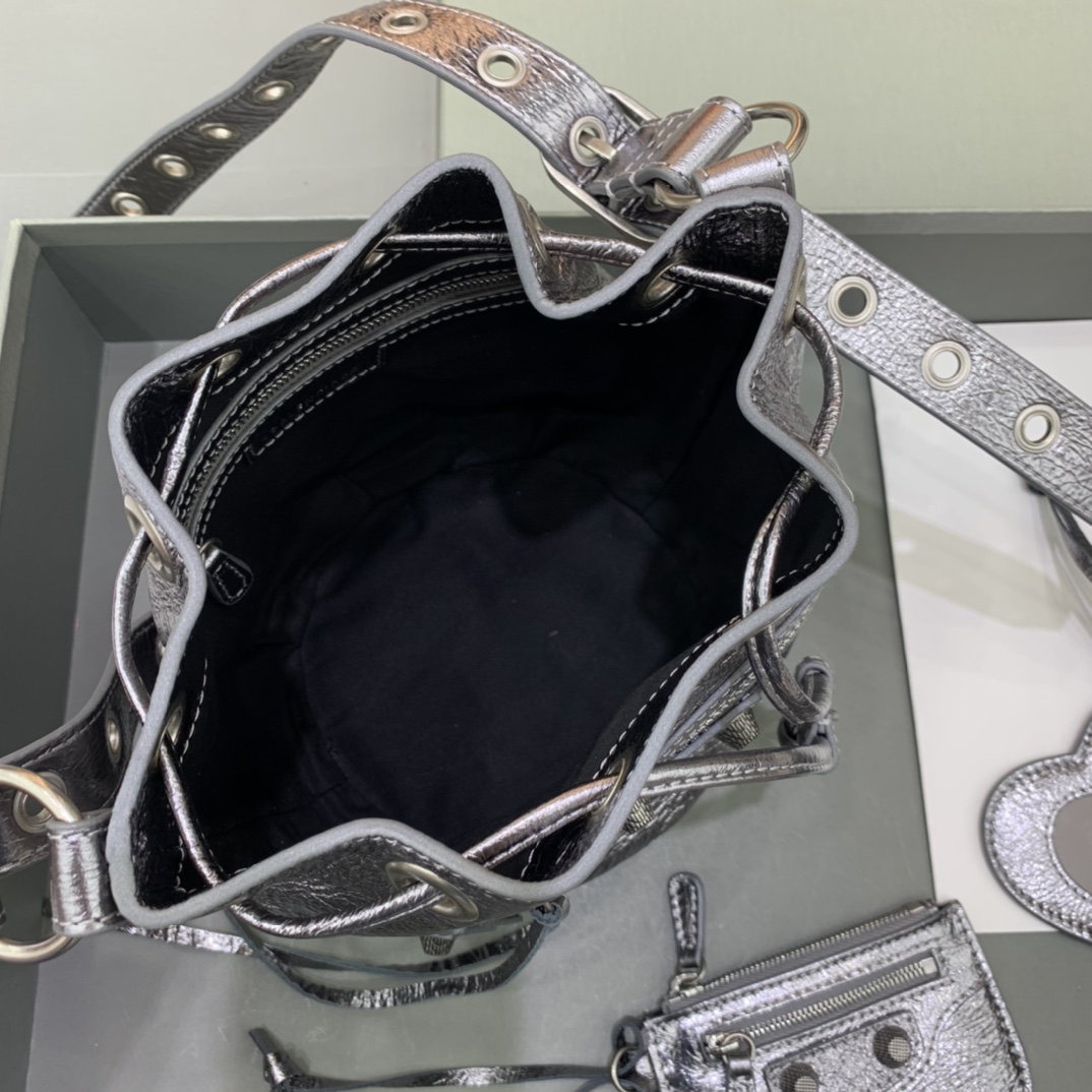 Balenciaga Le Cagole XS Bucket Bag In Silver Metallized Arena Lambskin, Aged-Silver Hardware With White Rhinestones(15-19.8-17.8cm) - FashionPlug