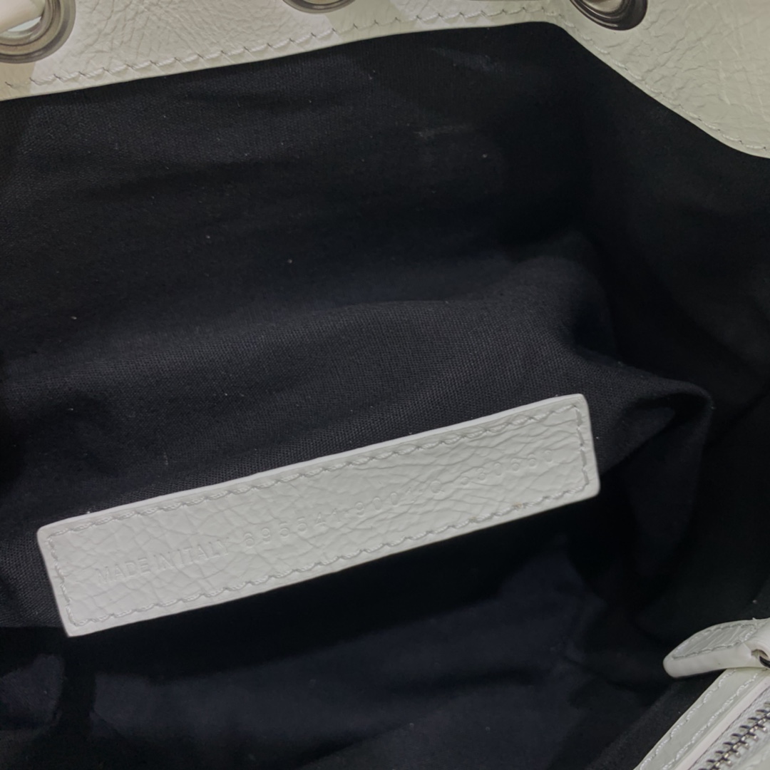 Balenciaga Le Cagole XS Bucket Bag In White Arena Lambskin, Aged-Silver Hardware(15-19.8-17.8cm) - FashionPlug