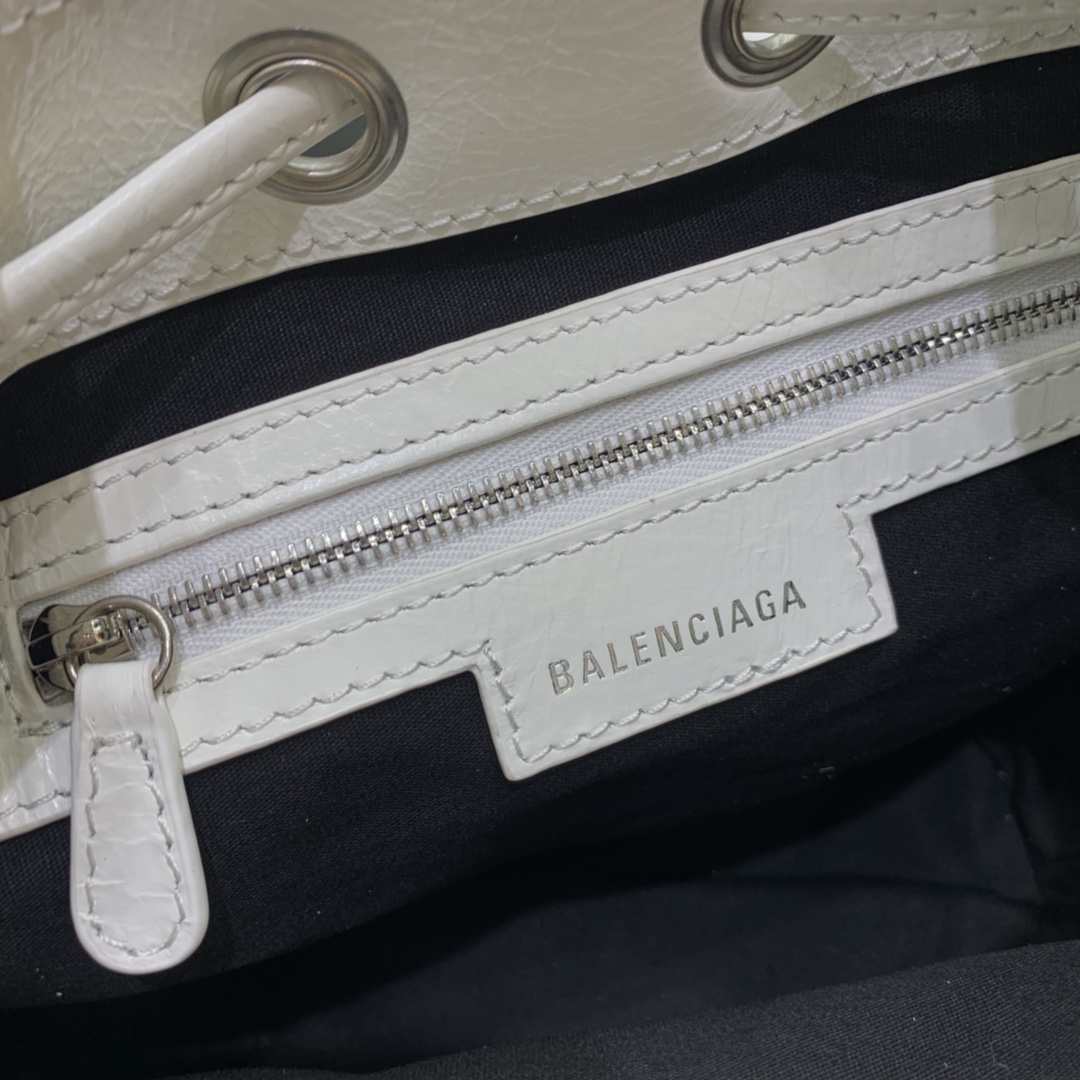 Balenciaga Le Cagole XS Bucket Bag In White Arena Lambskin, Aged-Silver Hardware(15-19.8-17.8cm) - FashionPlug