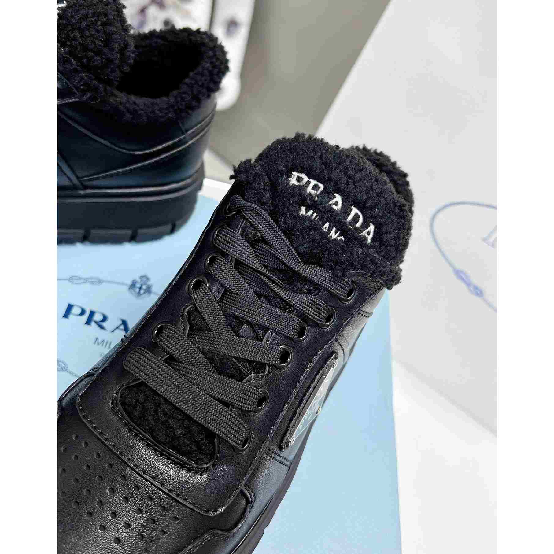 Prada Leather And Shearling Sneakers - FashionPlug
