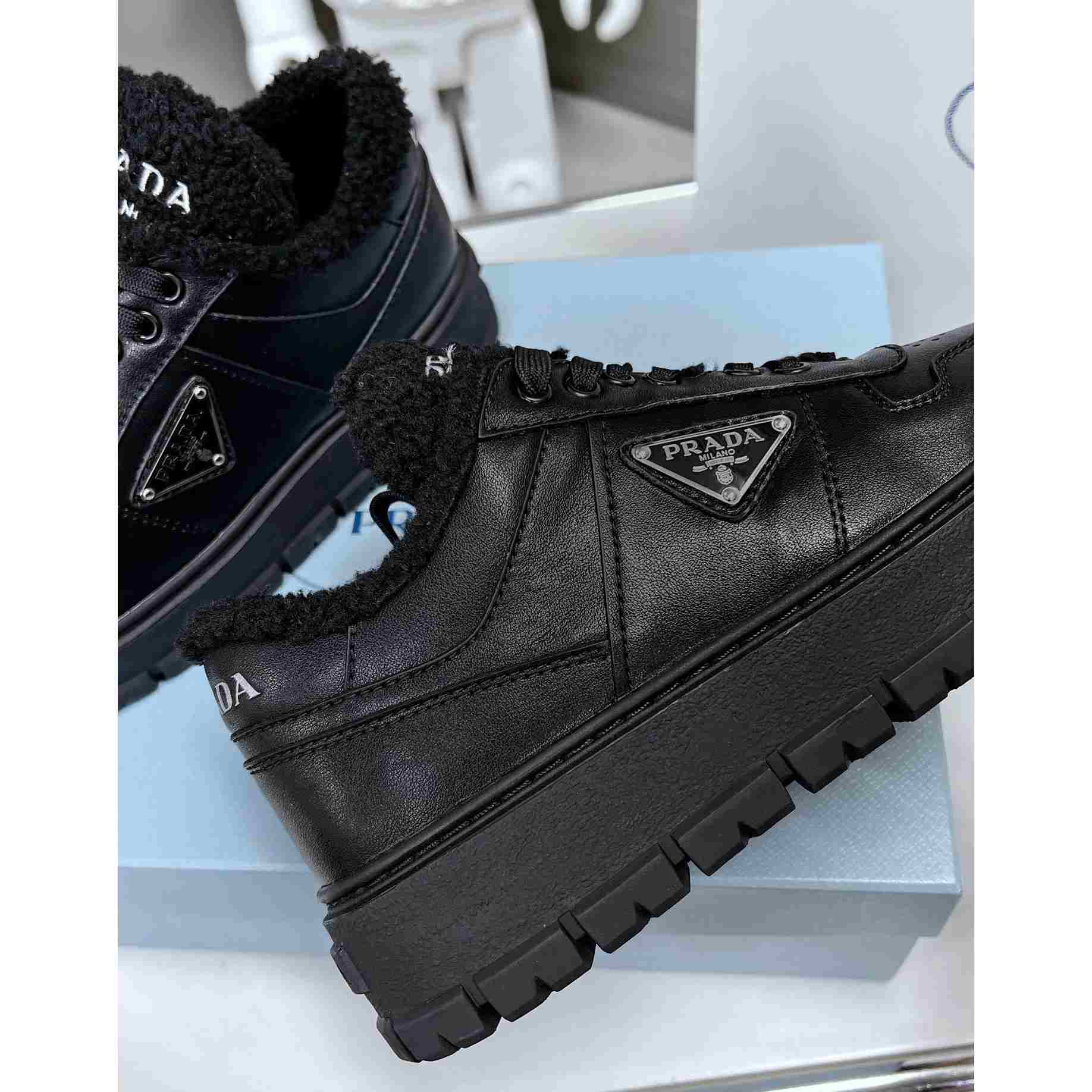 Prada Leather And Shearling Sneakers - FashionPlug
