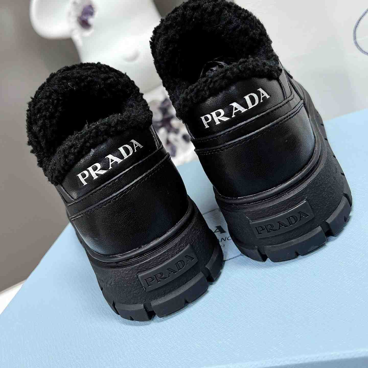 Prada Leather And Shearling Sneakers - FashionPlug