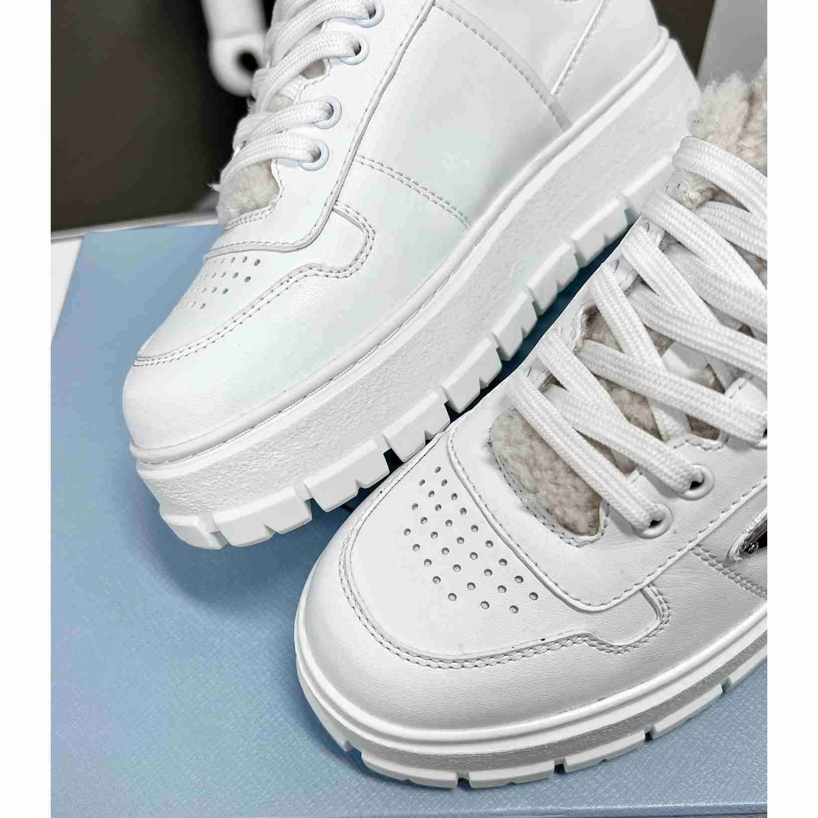 Prada Leather And Shearling Sneakers - FashionPlug