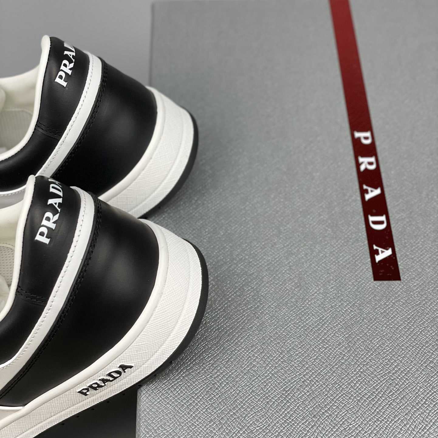 Prada Downtown Leather Sneakers - FashionPlug