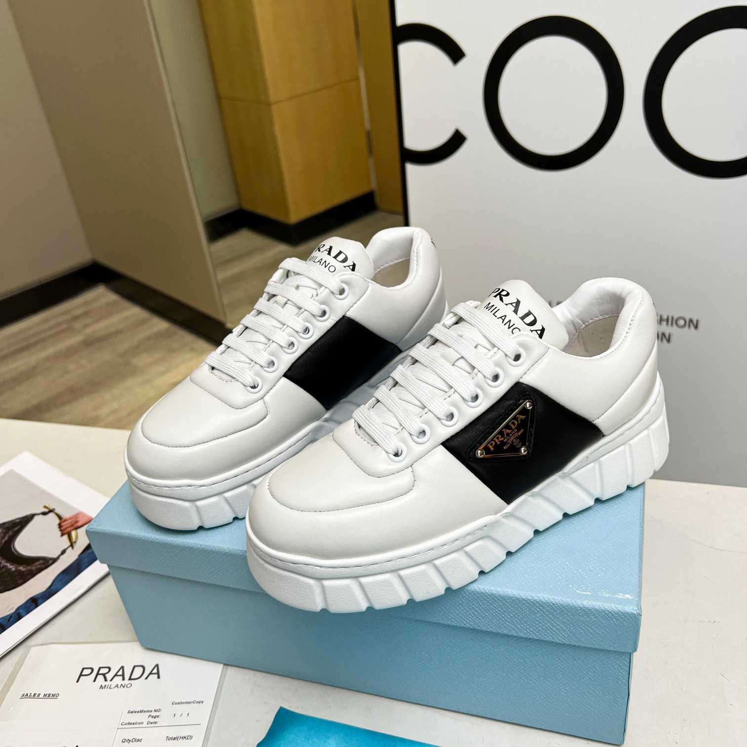 Prada Padded Nappa Leather Sneakers - FashionPlug