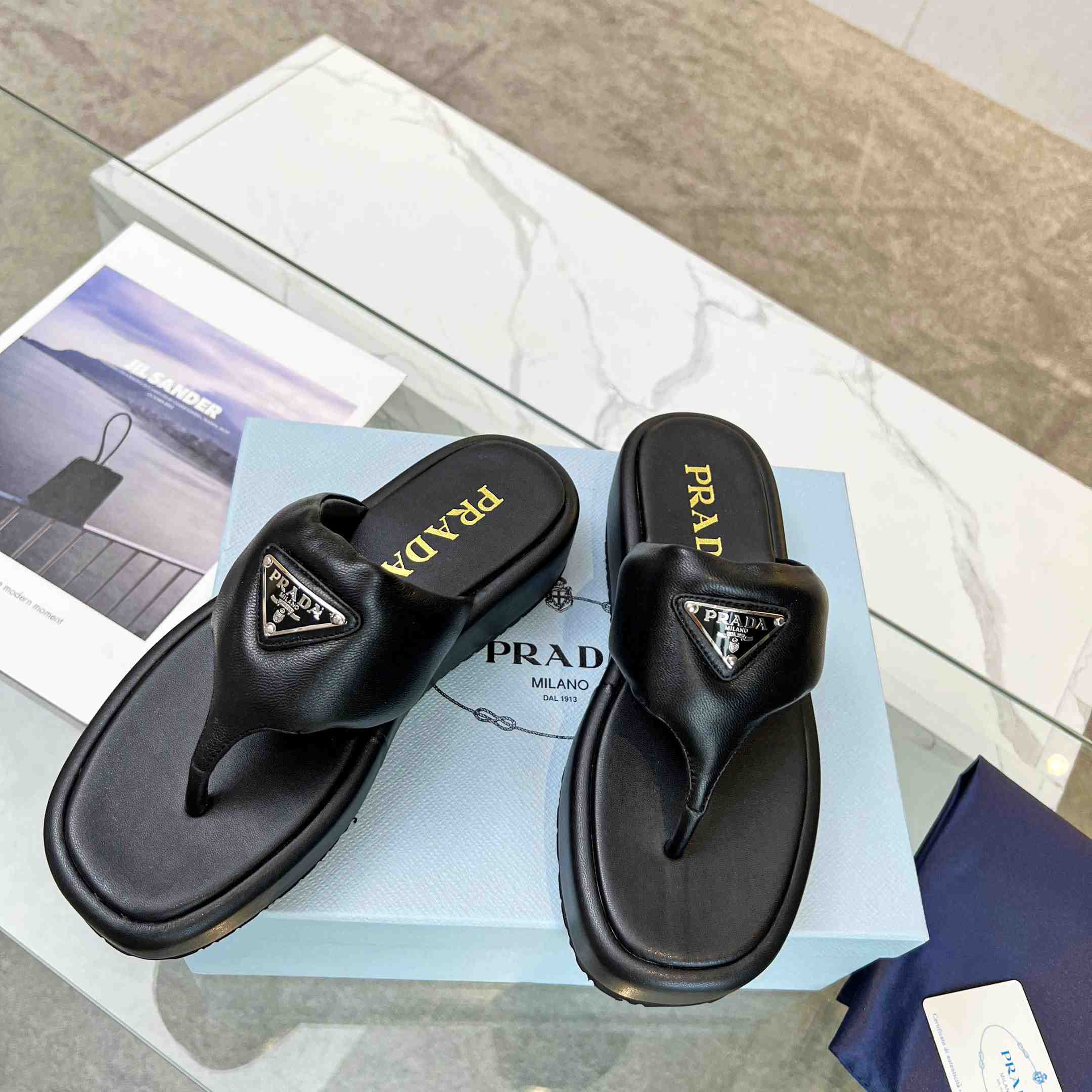 Prada Soft Padded Nappa Leather Thong Wedge Sandals - FashionPlug