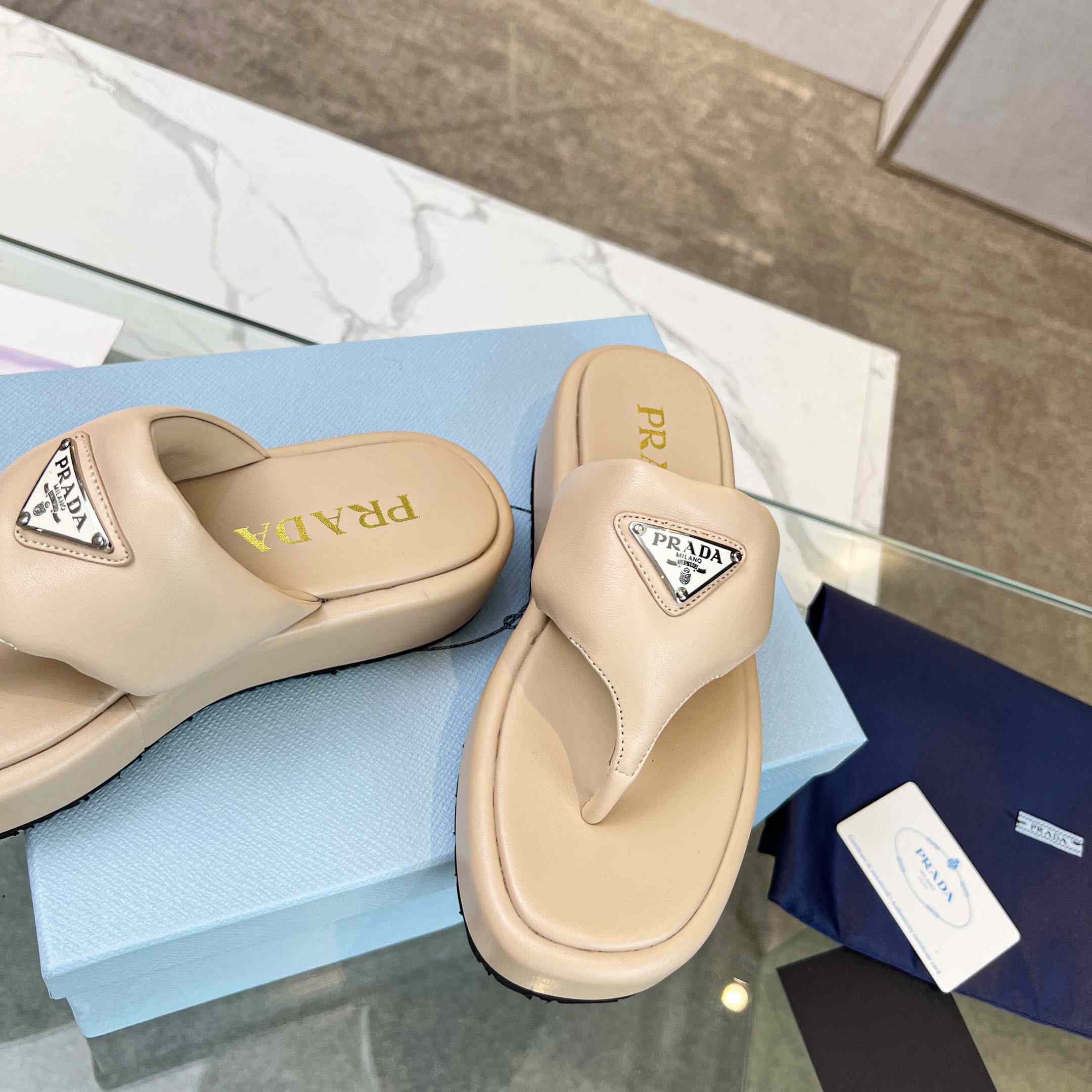 Prada Soft Padded Nappa Leather Thong Wedge Sandals - FashionPlug