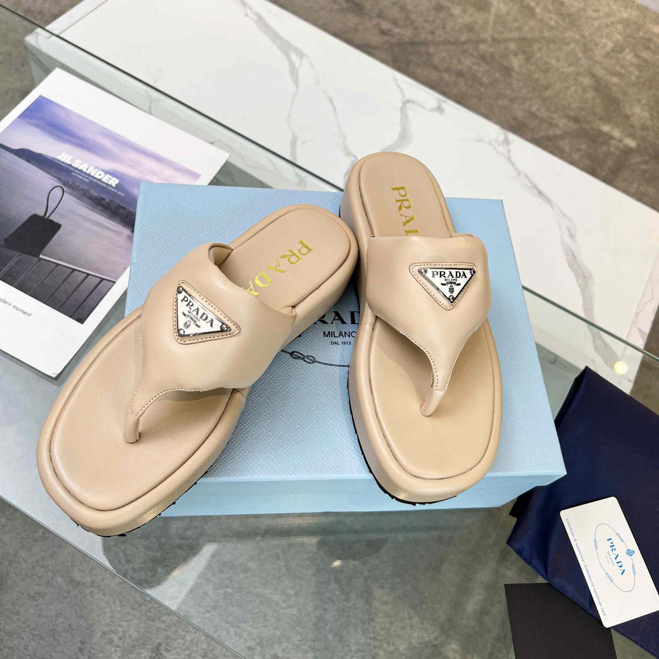 Prada Soft Padded Nappa Leather Thong Wedge Sandals - FashionPlug