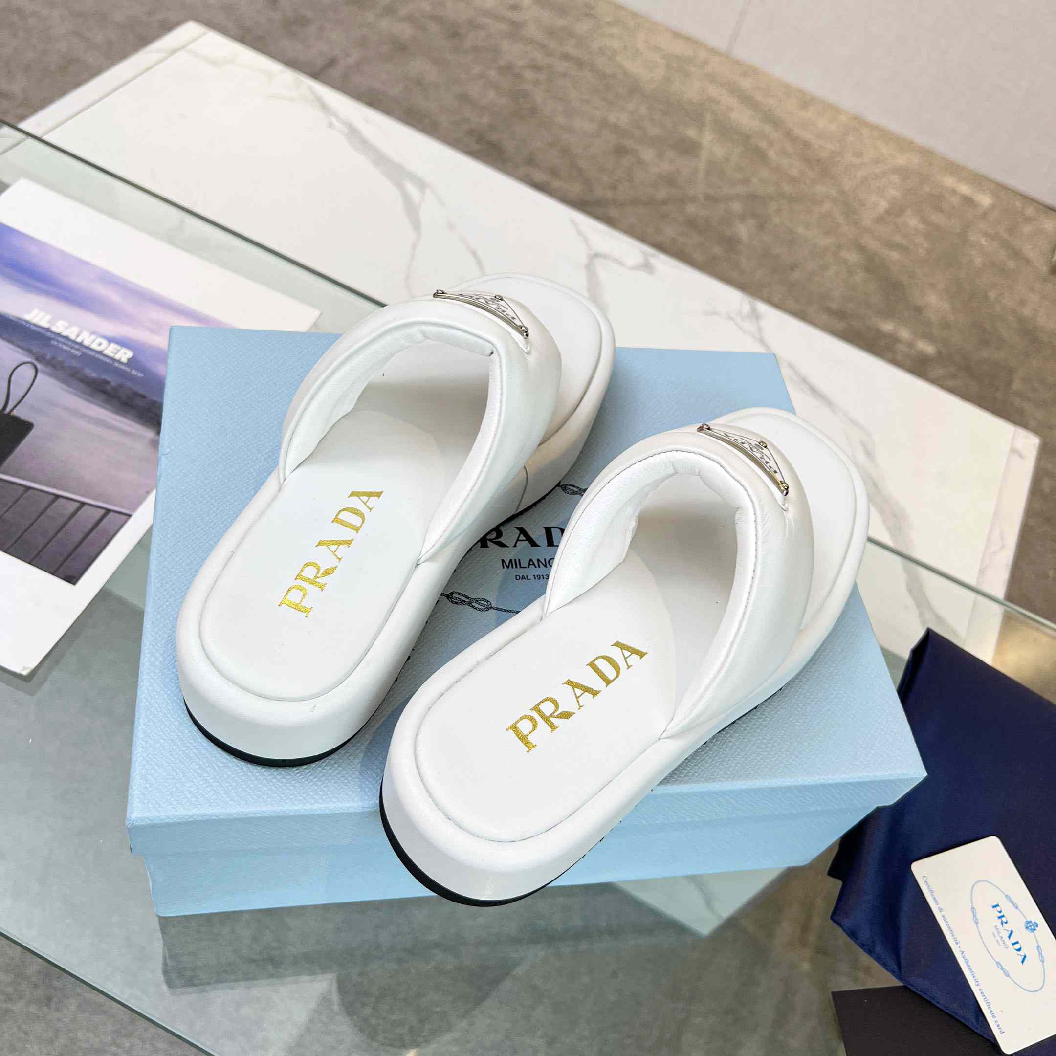 Prada Soft Padded Nappa Leather Thong Wedge Sandals - FashionPlug